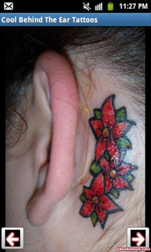 Red Flowers Behind Ear Tattoo