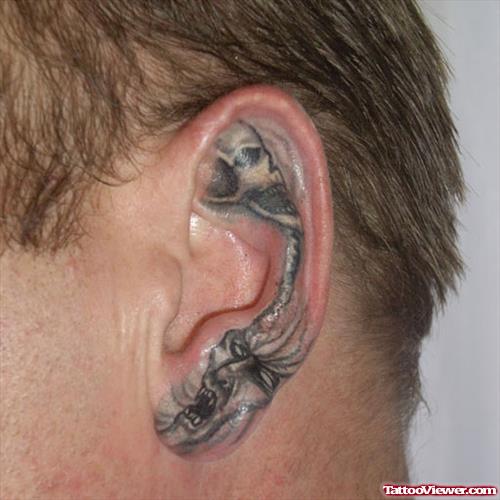 Grey Ink Skulls Ear Tattoo
