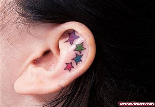 Colored Stars Ear Tattoo