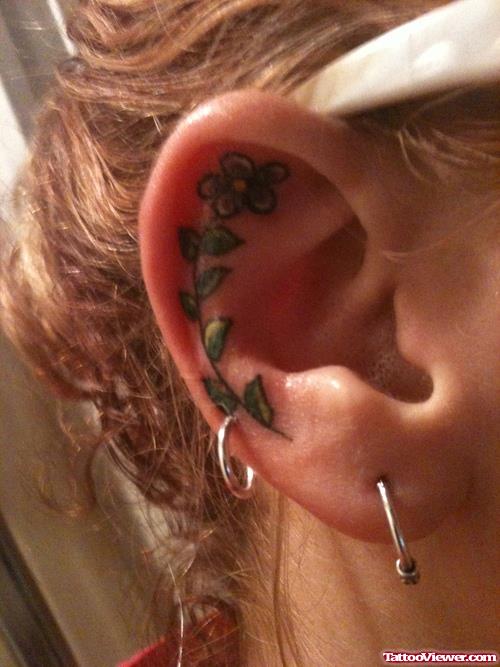 Green Leafs And Flower Ear Tattoo