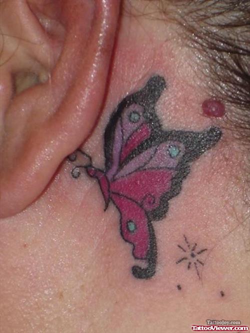 Colored Butterfly Tattoo Behind Ear