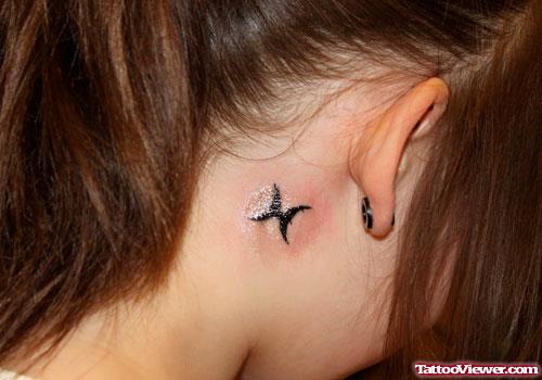 Black Ink Pisces Tattoo Behind Ear