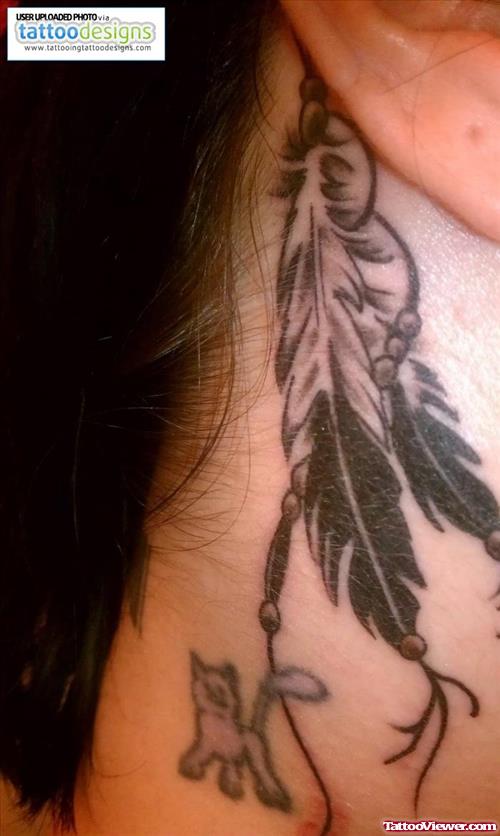 Feathers And Dog Ear Tattoo