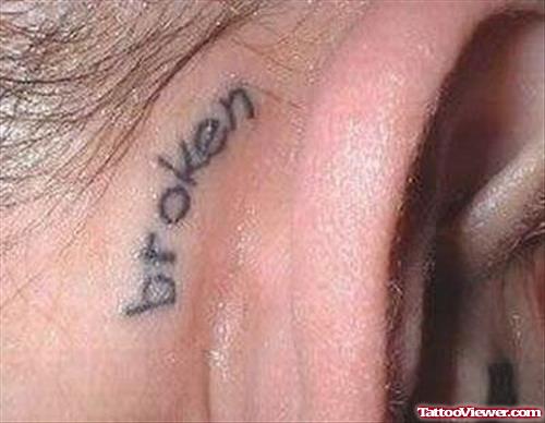Broken Word Ear Behind Tattoo