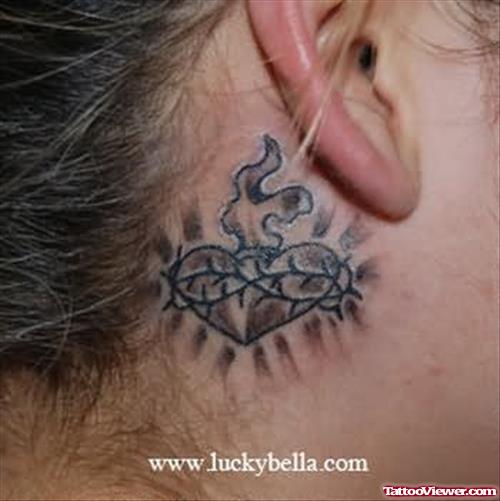 Burning Heart Tattoo Behind Ear