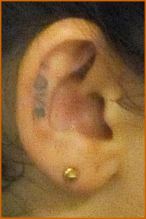 Beautiful Miley Cyrus Love Ear Tattoo