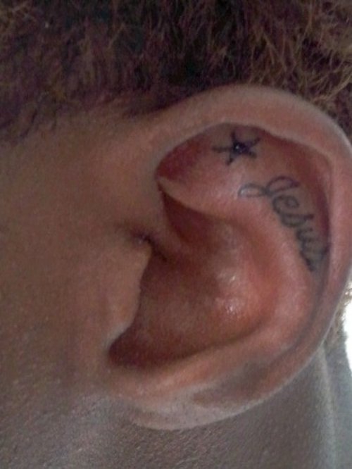 Star And Jesus Ear Tattoo