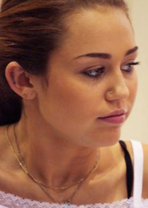 Miley Cyrus New Ear Tattoo
