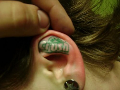 Green Ink Crush Ear Tattoo