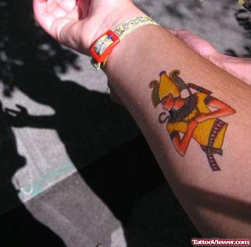 Yellow Ink Egyptian Tattoo On Right Forearm
