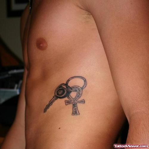 Key And Egyptian Ankh Tattoo On Man Side Rib