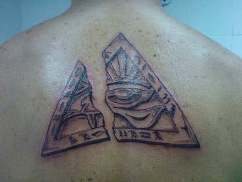 Grey Ink Egyptian Tattoo On Back