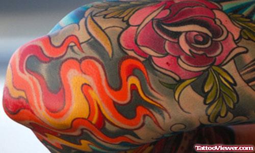 Rose And Flames Elbow Tattoo