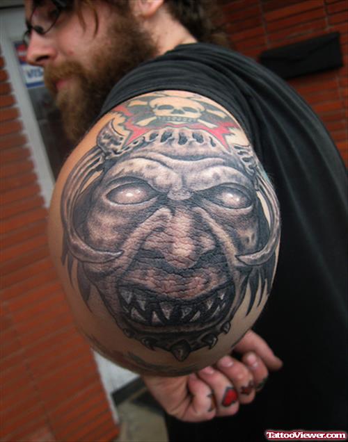 Demon Face Elbow Tattoo