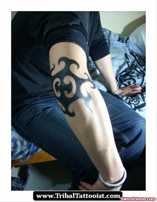 A Black Tribal Elbow Tattoo