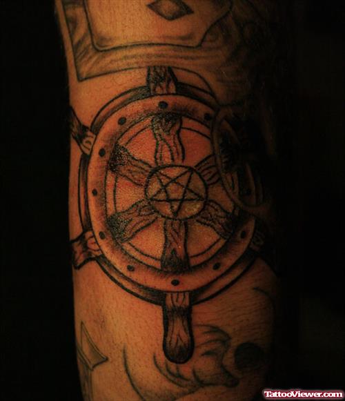 Grey Ink Ship Stering Elbow Tattoo