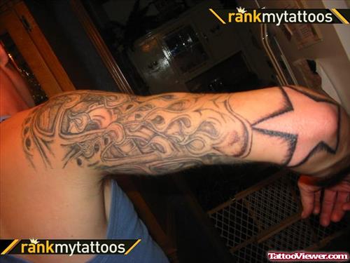 Grey Flames And Star Elbow Tattoo