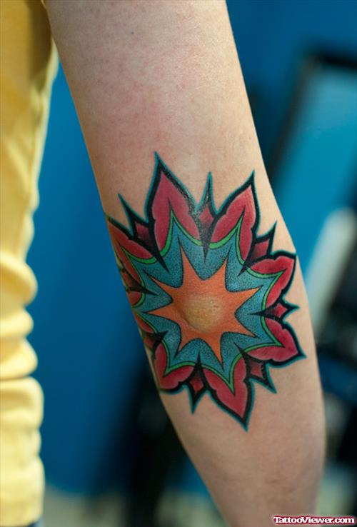 Blue And Red Ink Elbow Tattoo