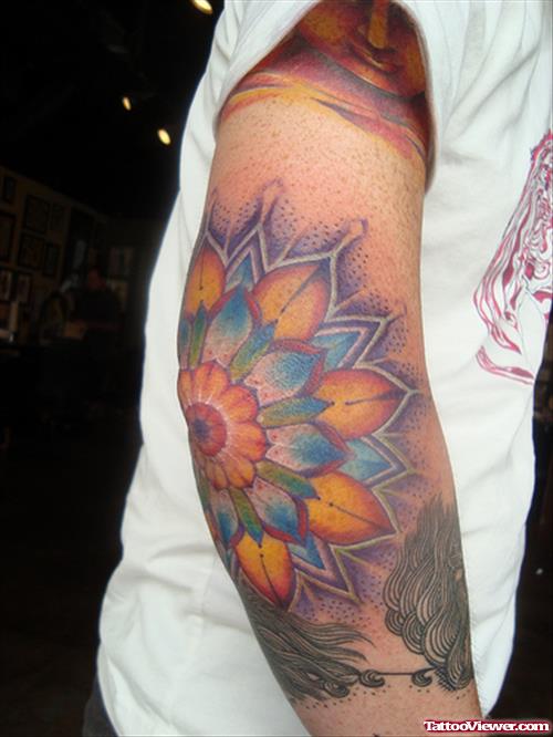 Blue And Yellow Elbow Tattoo