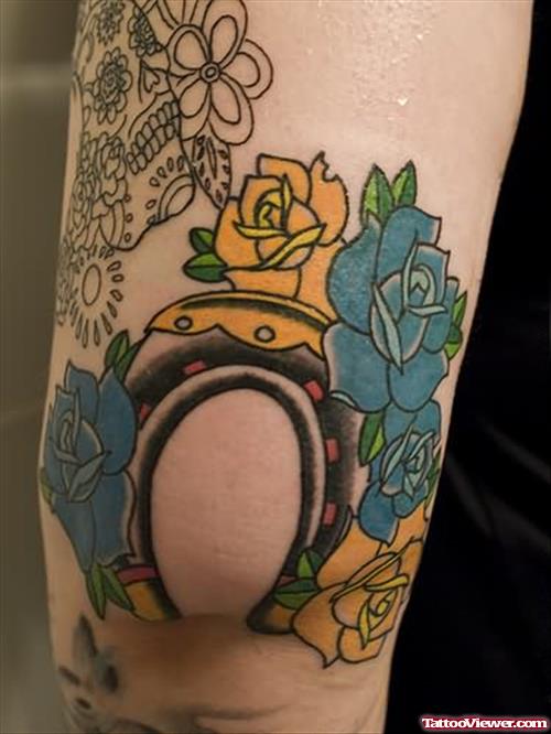 Flowers And Horseshoe Tattoo On Elbow