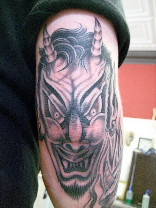 Demon Head Elbow Tattoo