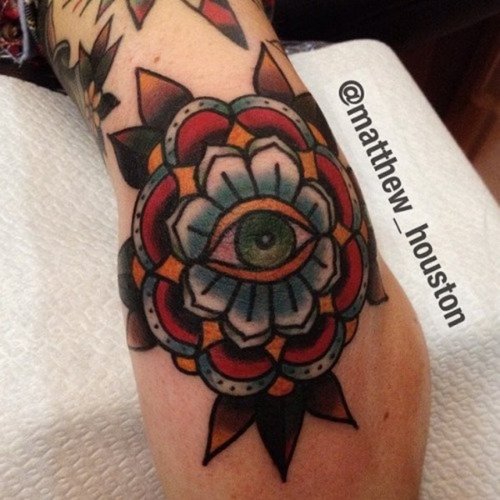 Traditional Eye In Flower Tattoo On Elbow