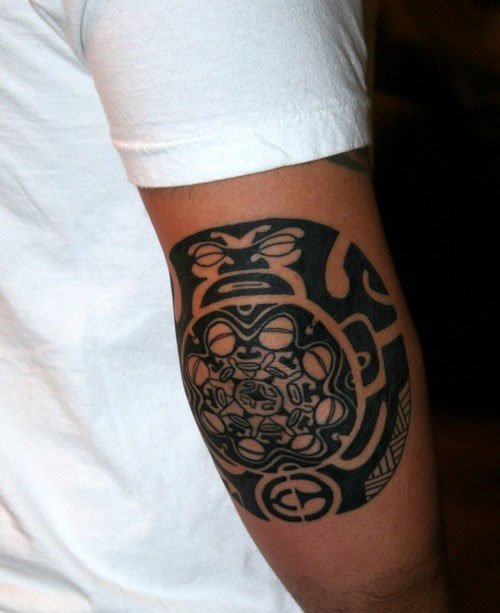 Black Ink Maori Tattoo On Elbow