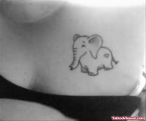 Tiny Elephant Tattoo On Chest