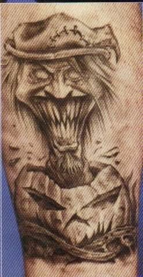 Grey Ink Evil Bicep Tattoo