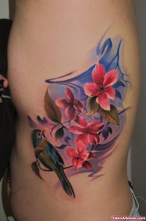 Extreme Colored Flowers Tattoos On Side Rib