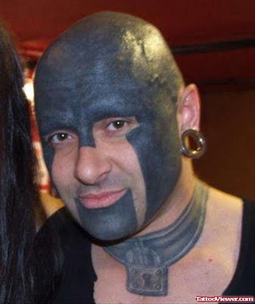 Extreme Black Ink Face and Neck Tattoo