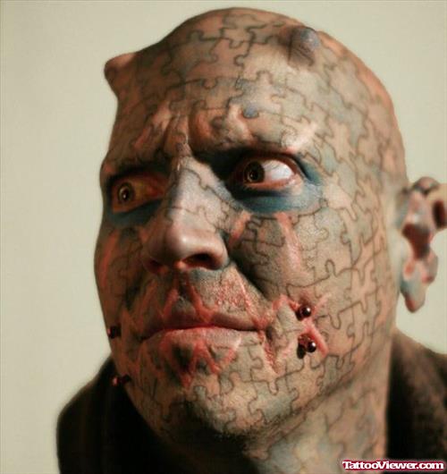 Extreme Puzzle Tattoo On Face