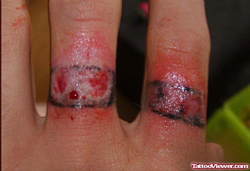 Extreme Finger Ring Tattoos