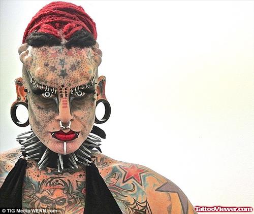Girl With Extreme Tattoo On Face And Body
