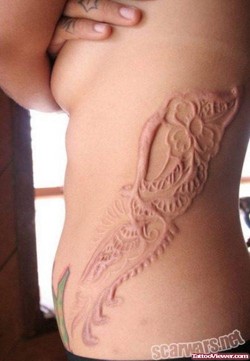 Extreme Henna Implants Tattoo On Side