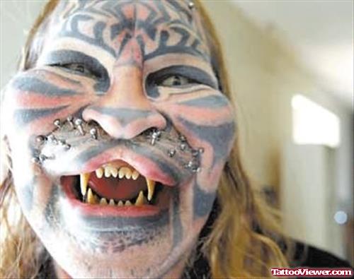 Extreme Cat Man Tattoo On Face