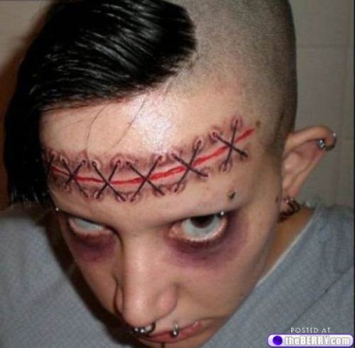Extreme Stitches Tattoos on Forehead