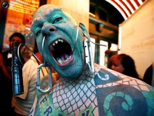 Extreme Colored Tattoo On Face And Body