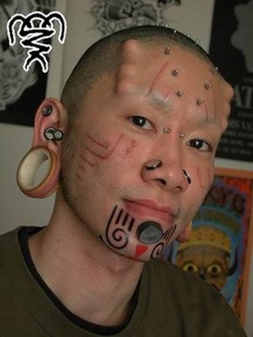 Extreme Piercing And Tattoos On Face