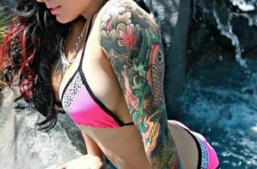 Colored flowers And Koi Tattoo On Girl Left Sleeve