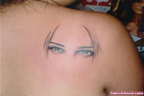 Girl Eyes Tattoo On Right Back Shoulder