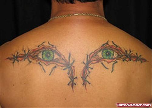 Colored Stitched Eye Tattoos On Upperback