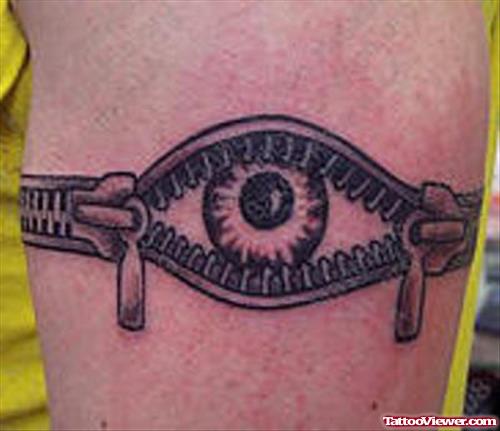 Zipper Eye Tattoo On Bicep