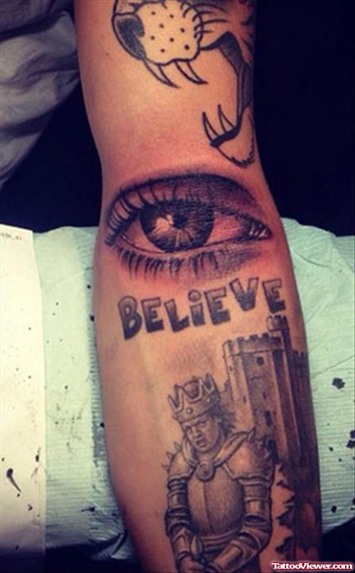 Grey Ink Eye Tattoo On Justin Bieber Tattoo On Sleeve