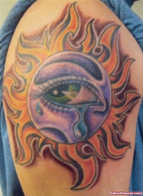 Colored Eye Tribal Sun Tattoo On Right Half Sleeve