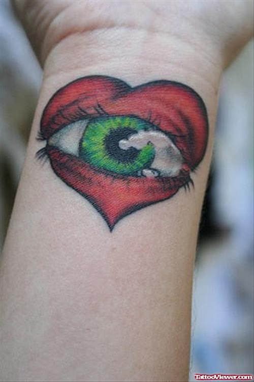 Red Heart With Eye Tattoio On Wrist