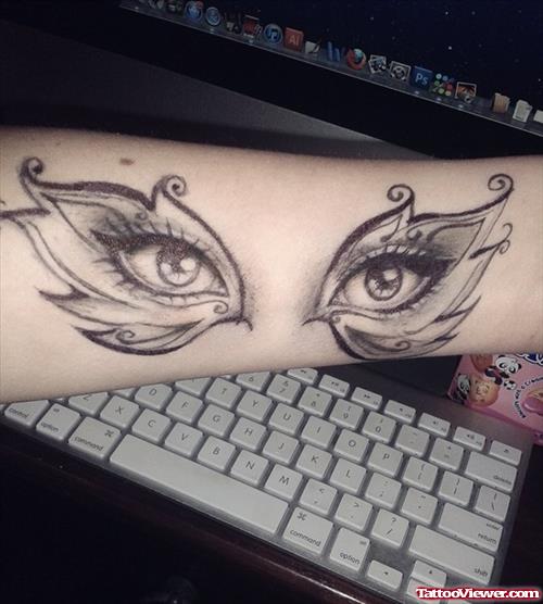 Grey Ink Eyes Tattoos On Left Sleeve
