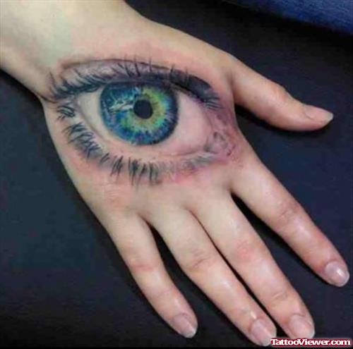Colored Eye Tattoo On Girl Right Hand