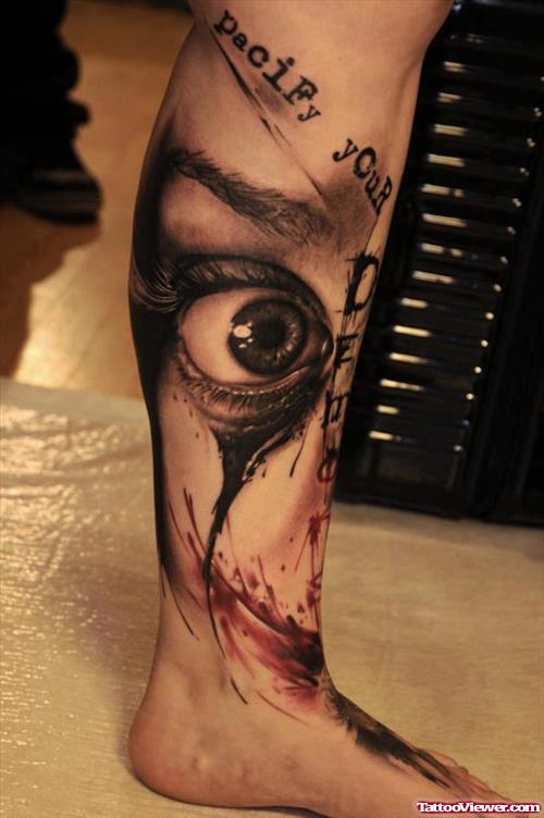 Grey Ink Eye Tattoo On Man Left Leg