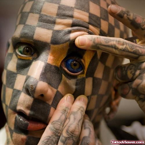 Chess Tattoo On Face and Blue Eyeball Tattoo